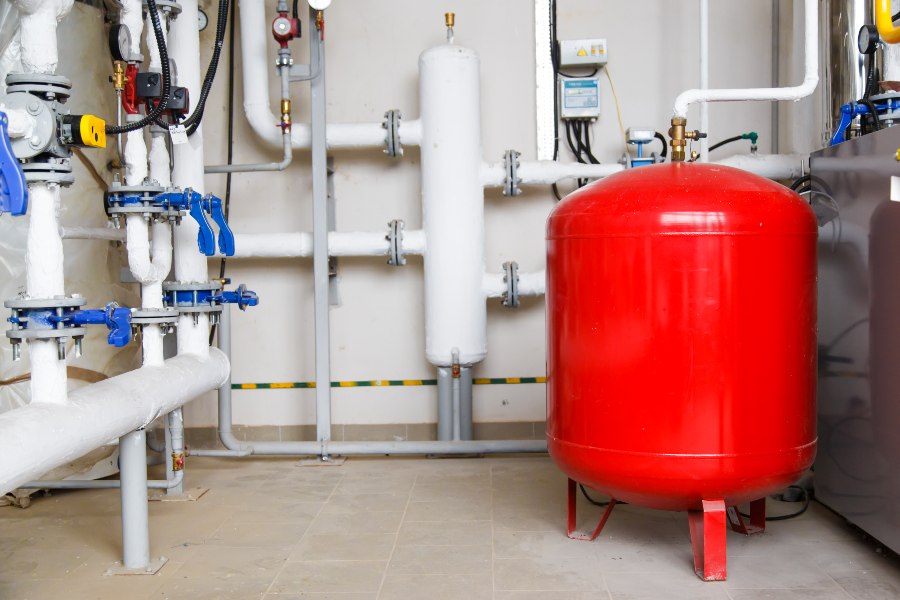 A red water heater which helps in water heater expansion in South Kansas City.